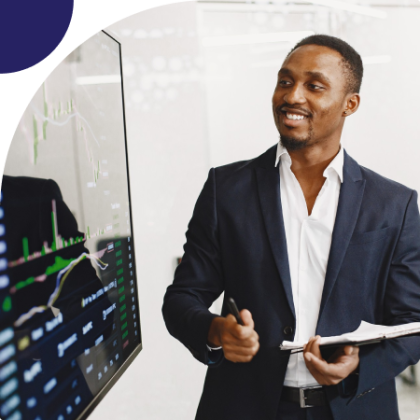 Two hands shaking over financial documents